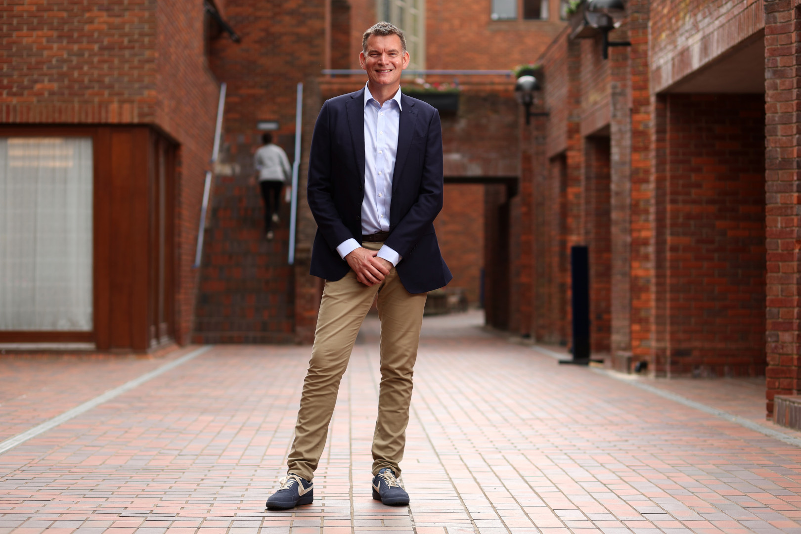 James Harrison, founder of Cycle pharmaceuticals, standing in the grounds of Robinson College, Cambridge.