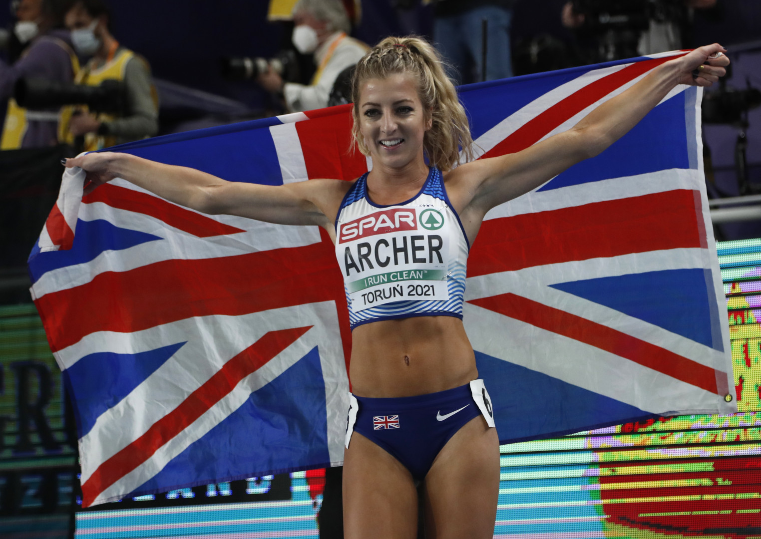 Holly Archer, second-place winner, celebrates with a British flag.