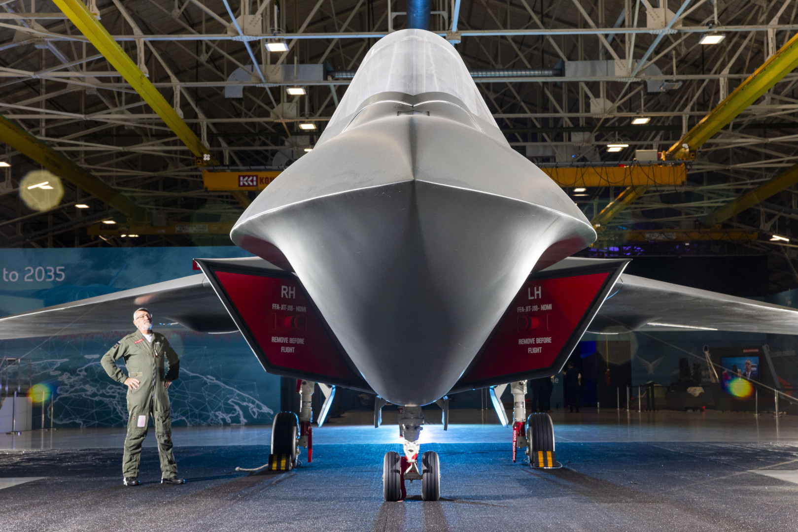 A model of the Tempest next-generation RAF fighter jet with a person standing in front of it.